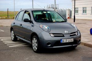 A rented Nissan Micra in Donegal, Ireland. Beware the business travel myths about rental cars!