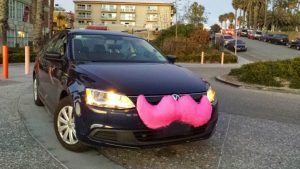 The instantly recognizable pink mustache of a Lyft car. It's becoming a favorite method of travel among business travelers.