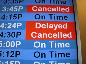 Photo of a flight departure screen showing a delayed flight. Google Flights can more easily predict these now.