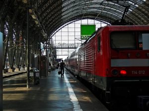 A train in a station. A travel writer suggested riding trains overnight to save money and time.