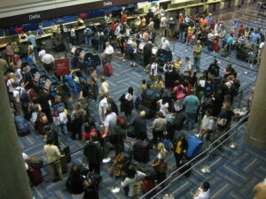 Long line at the airport. You'll be in one of these if you find yourself getting bumped on a flight.