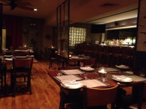 Photo of an empty restaurant. One of our travel predictions is that people will begin to flock to restaurants.