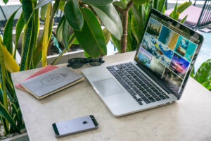 A laptop, nomad, and mobile phone are all part of the digital nomad life.