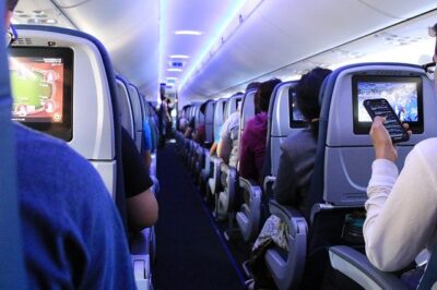 Interior of an airplane. Photo taken a few years ago, of course. But more people are traveling for business these days.