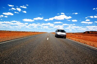 A single car in the Australian outback. It's a metaphor for the car rental shortage.