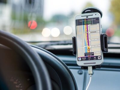 A phone's GPS. Downloading travel apps like a gas station app is one of our road trip travel tips!